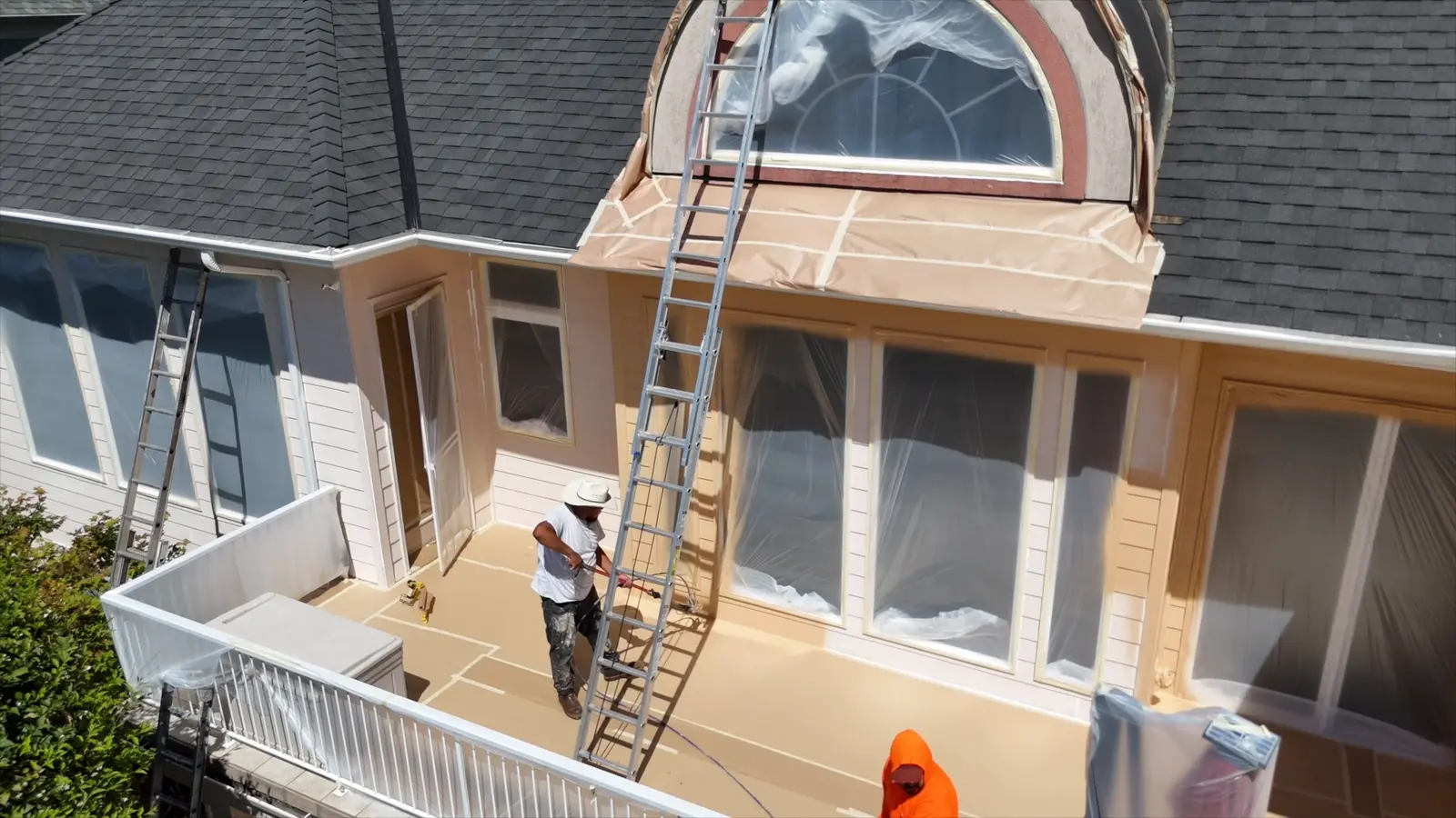 QC crew masking the upper deck and windows before spraying