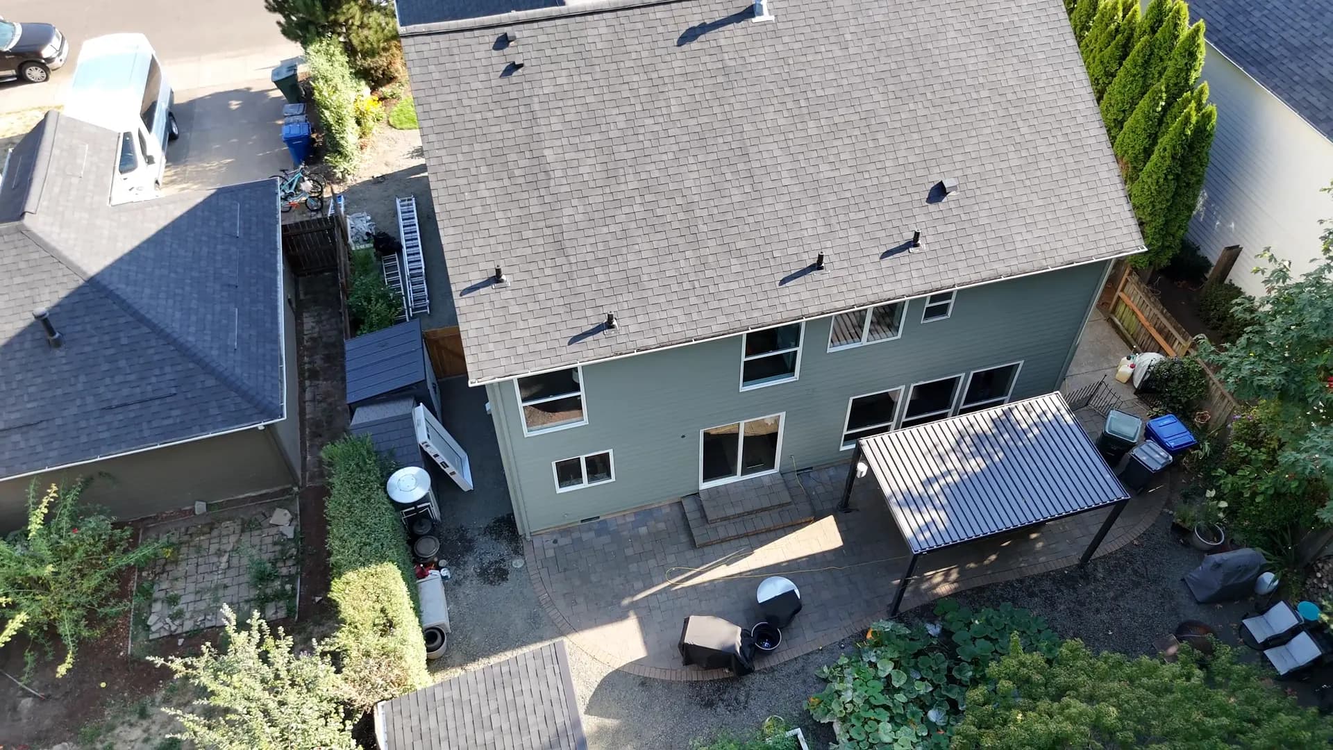 Aerial view of the back yard, patio cover and repainted house