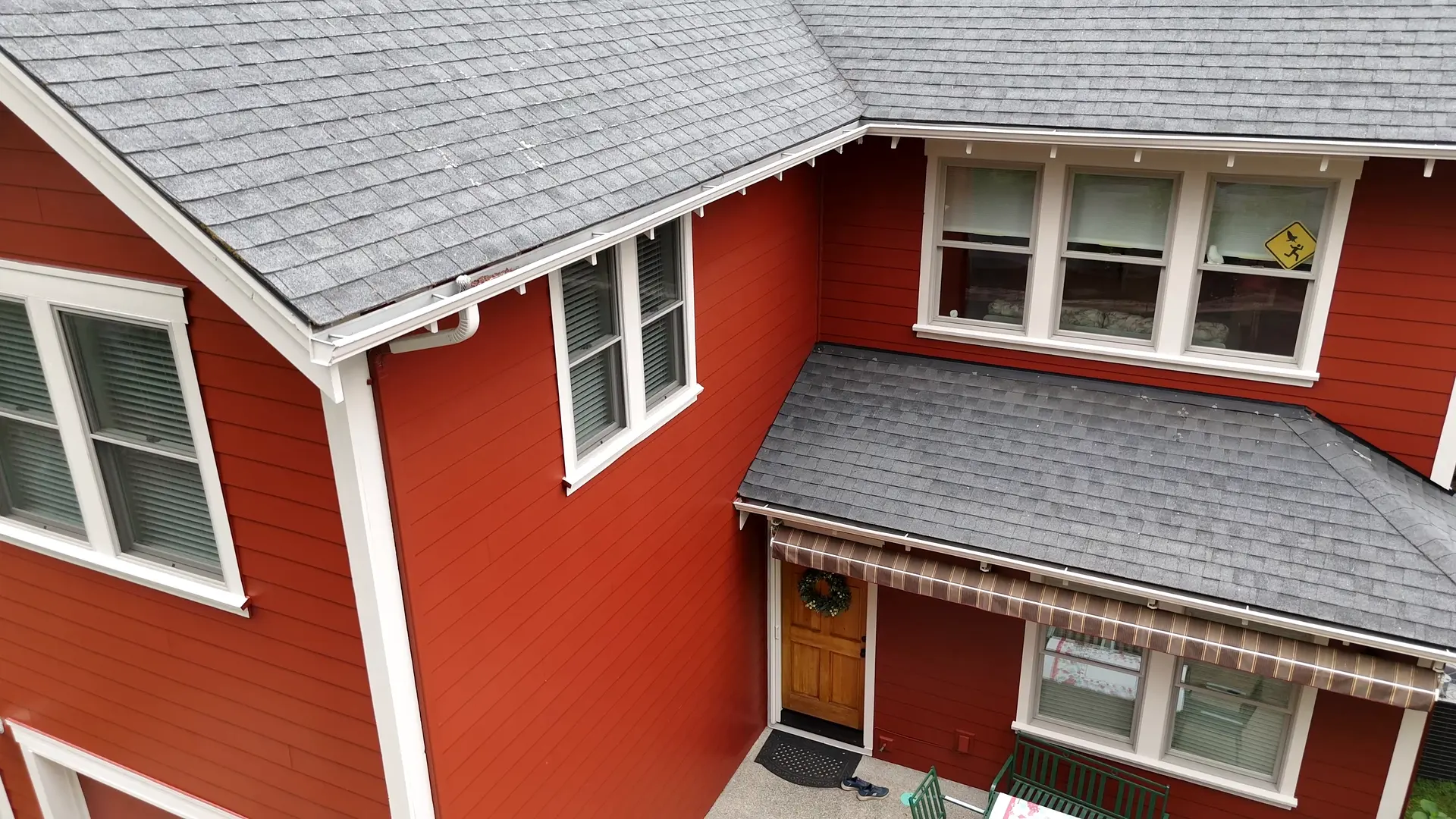 Back of the Craftsman after painting, deep red siding and white trim