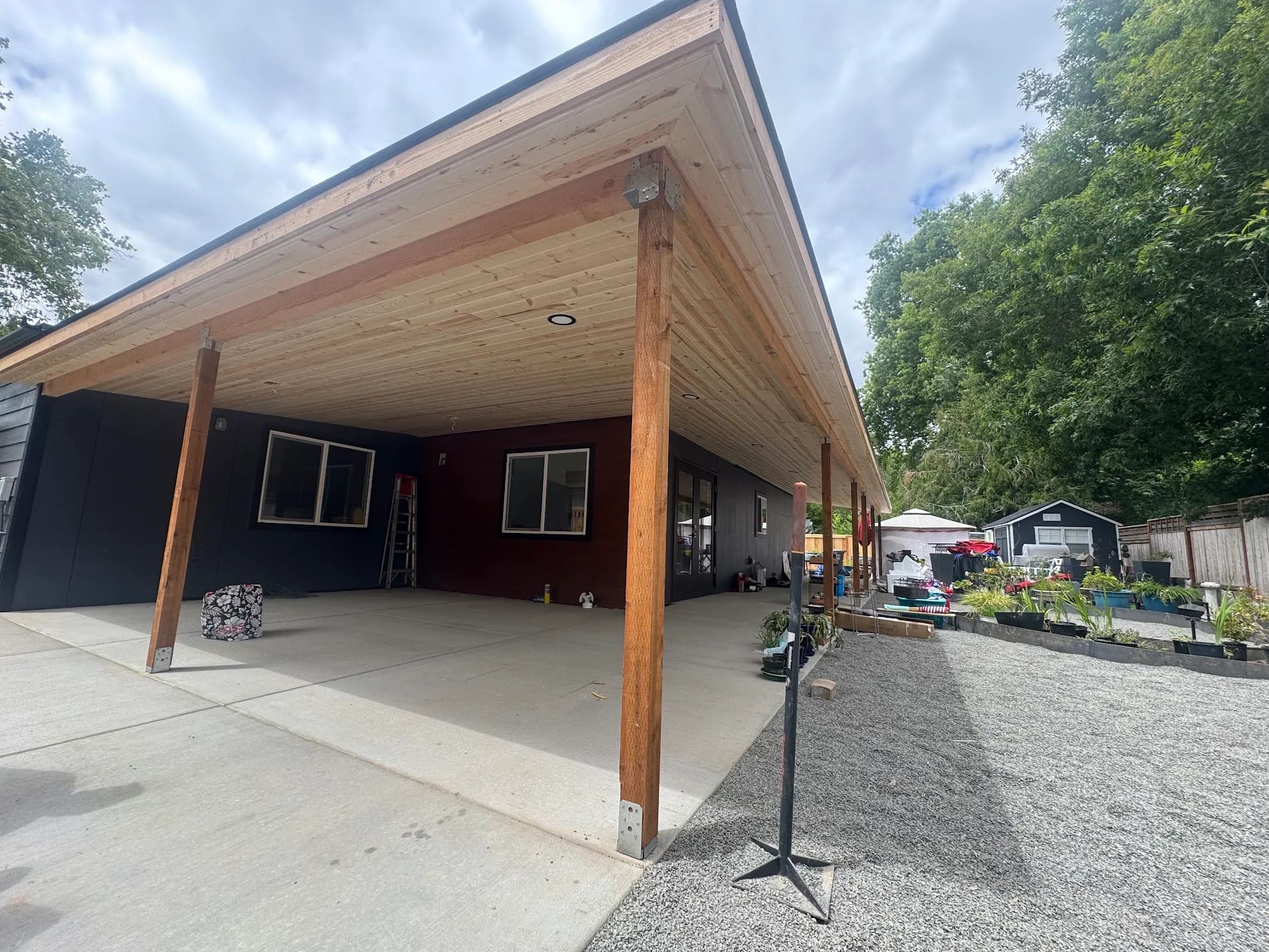 QC Painting patio covers project in Oregon